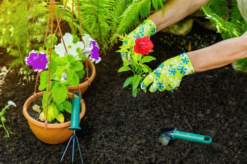 Team member preparing equipment for garden maintenance