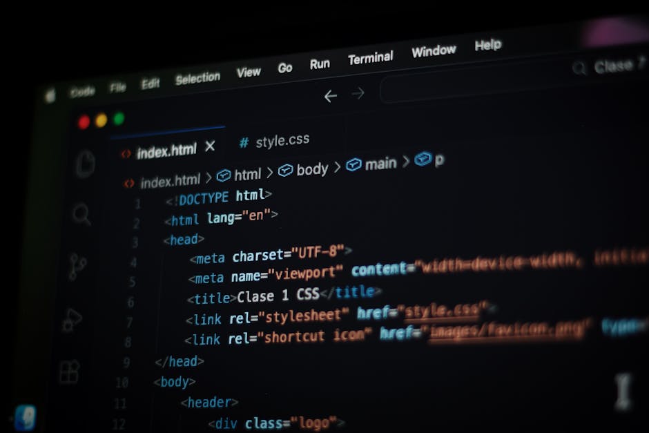 A close-up view of a computer screen displaying HTML code in a text editor, with visible lines of code including elements like '<!DOCTYPE html>', '<html>', '<head>', '<title>', and '<body>'. The code 